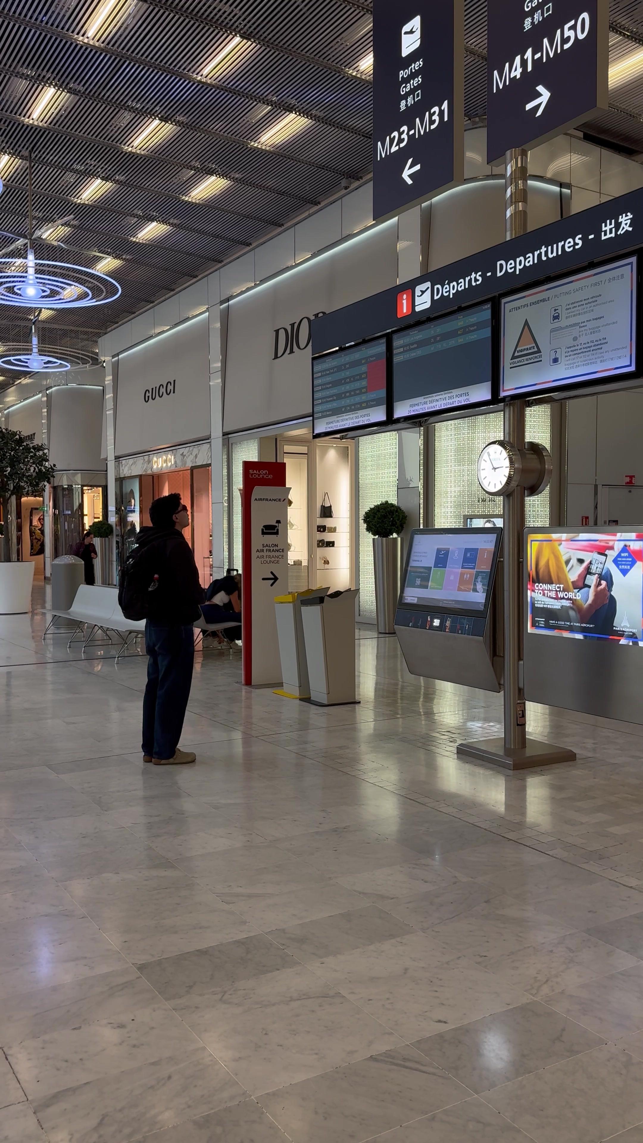 Traveler Walking Through Airport Terminal