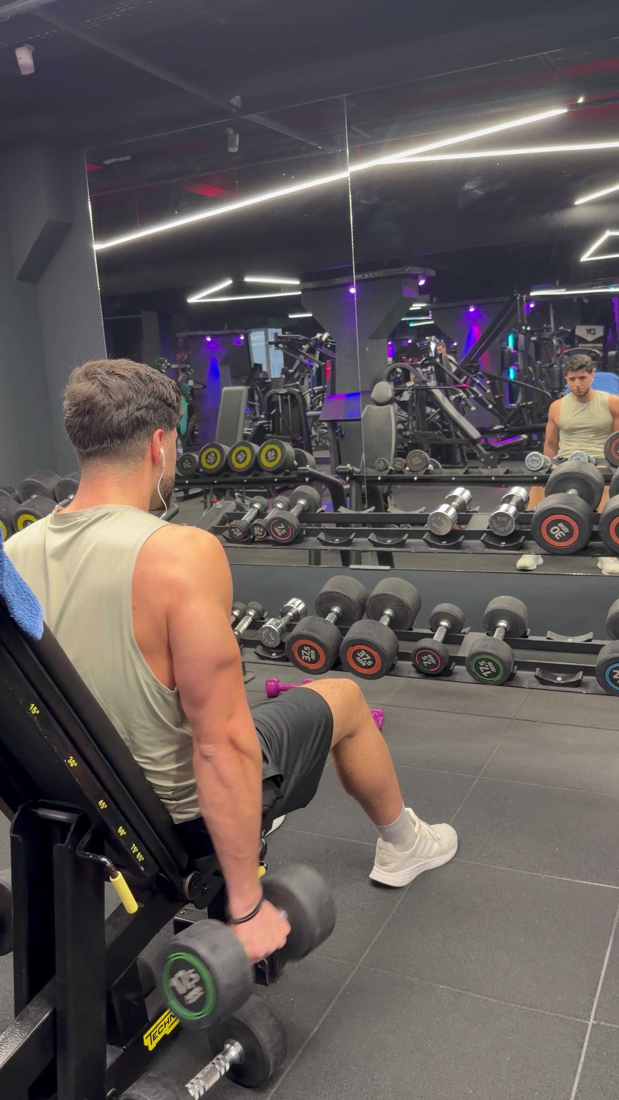 Man Performing Incline Dumbbell Bicep Curls